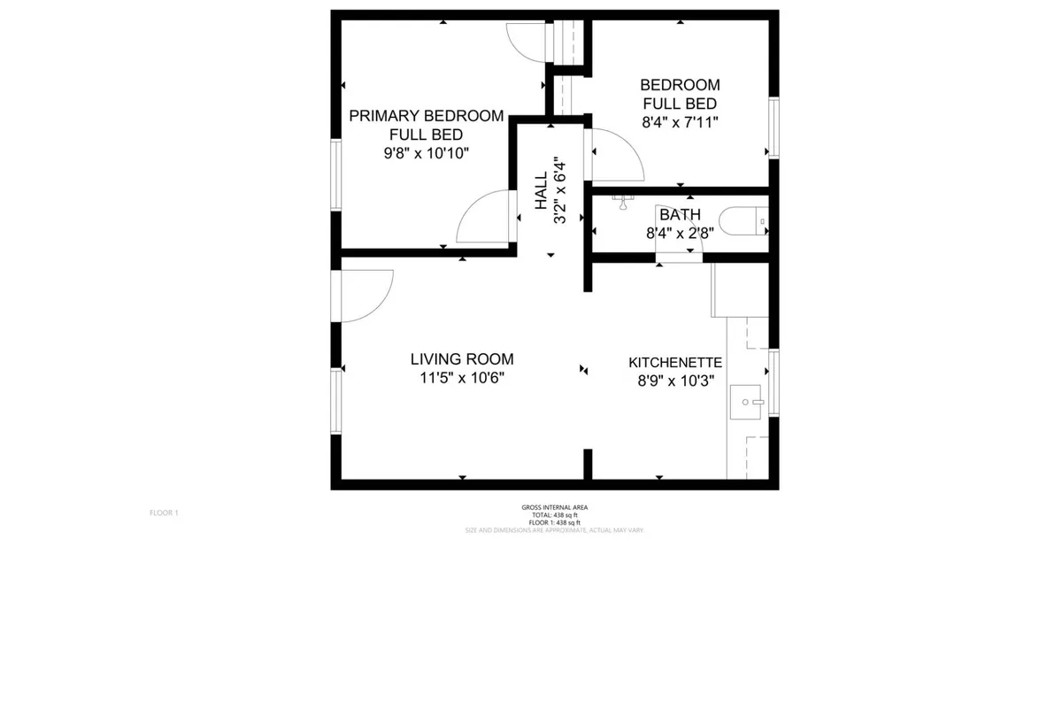 This interior shot captures a broader view that includes the living room, a glimpse of the primary bedroom, kitchenette, and bathroom. The space feels inviting and practical, highlighting the interconnected yet private areas that support comfort, whether guests are relaxing, sleeping, or preparing for the day.